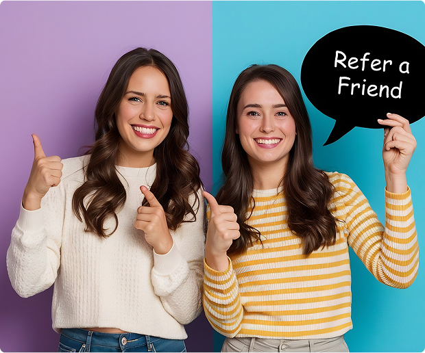 happy-two-young-girls-laughing-pointing-finger-screen-smartphone-while-taking-selfie-isolated-blue-wall 1